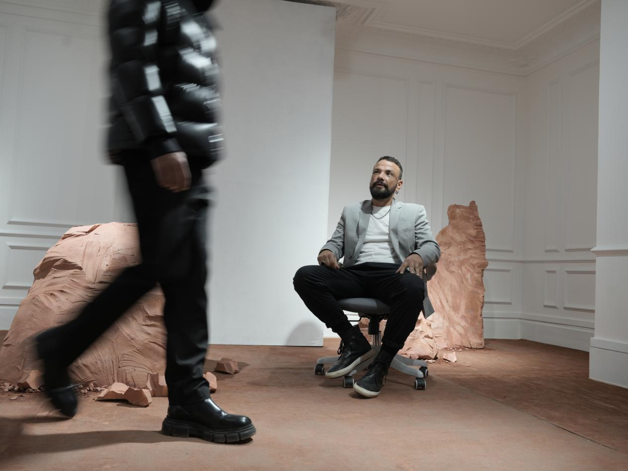 Designer Burak Uyan during the GUVET showroom presentation in Paris